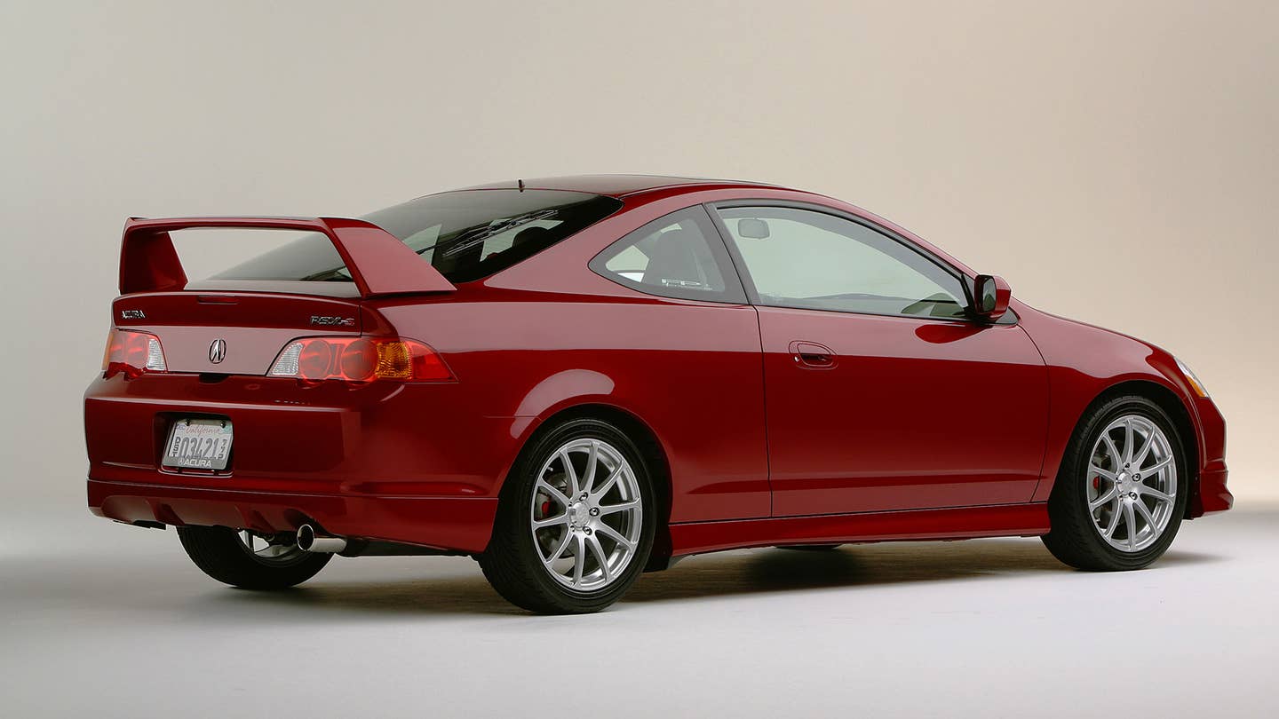 Rear quarter view studio photos of the 2003 Acura RSX Type S Performance Package.