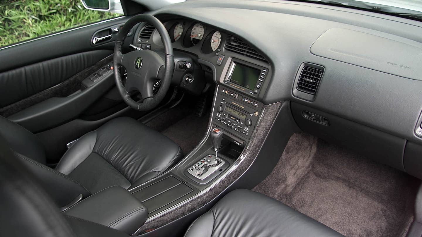 The black interior of a 2002-2003 3.2 TL Type S. 