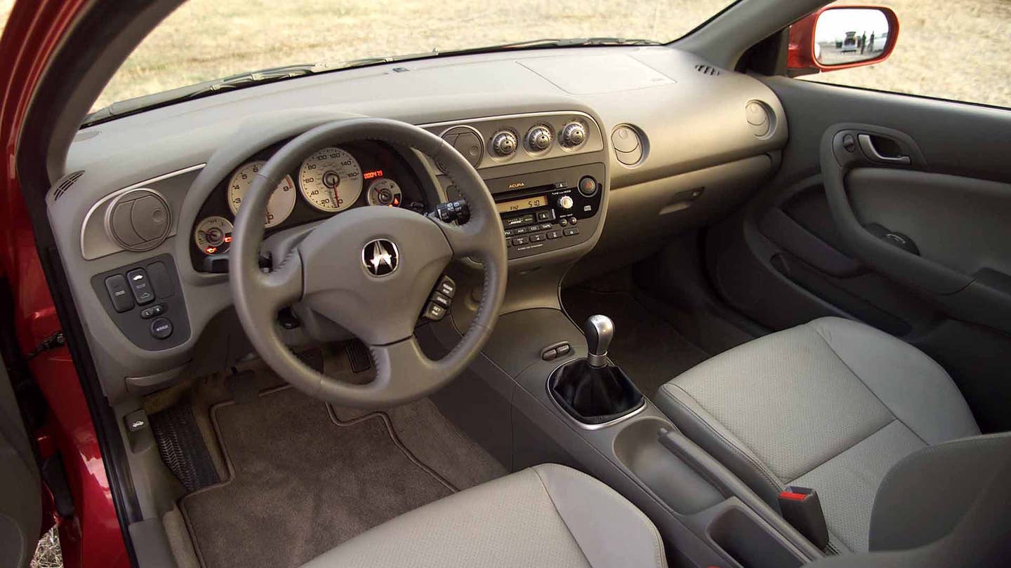 The front seats and dashboard on a 2002-2004 Acura RSX Type S.