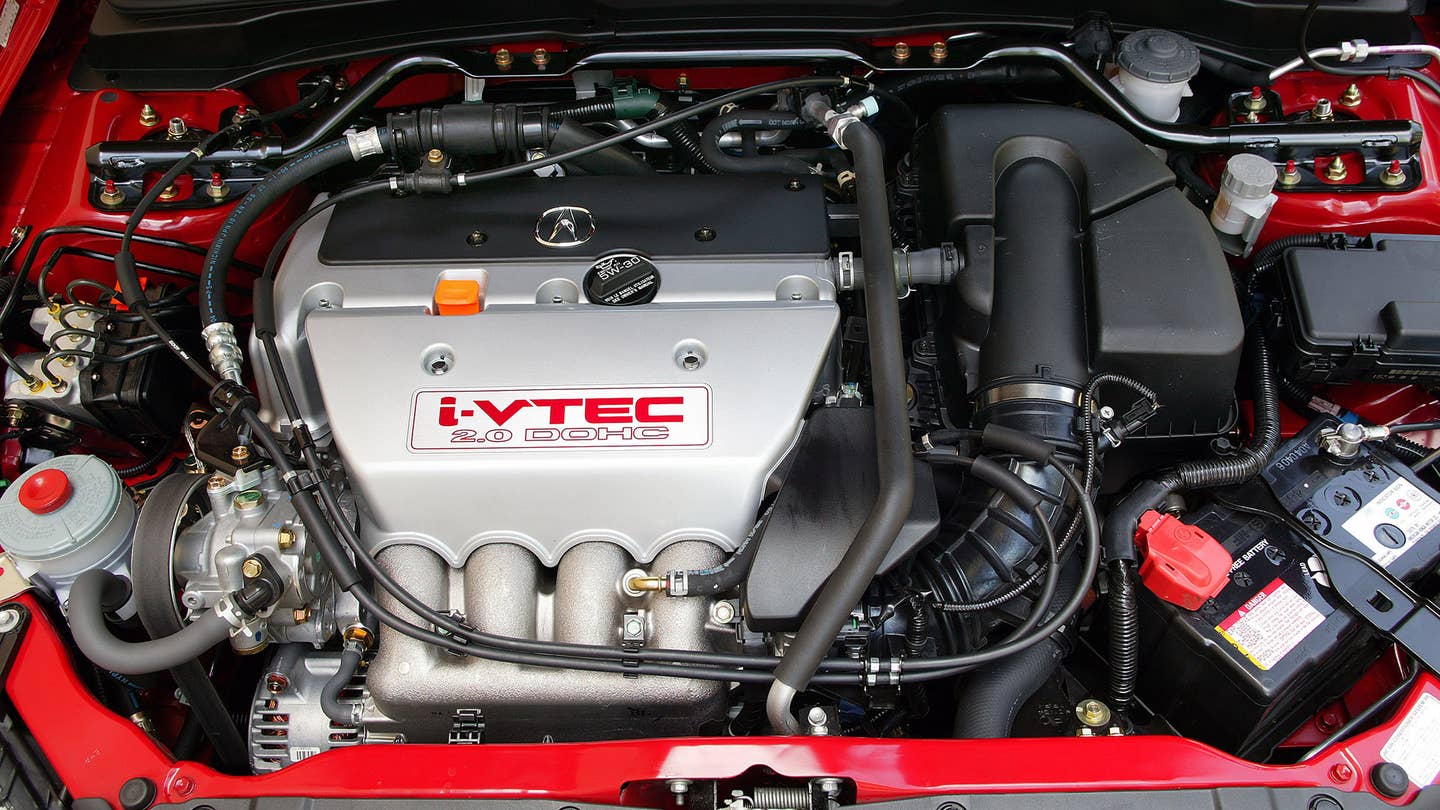 The engine of a red 2005-2006 Acura RSX Type S.