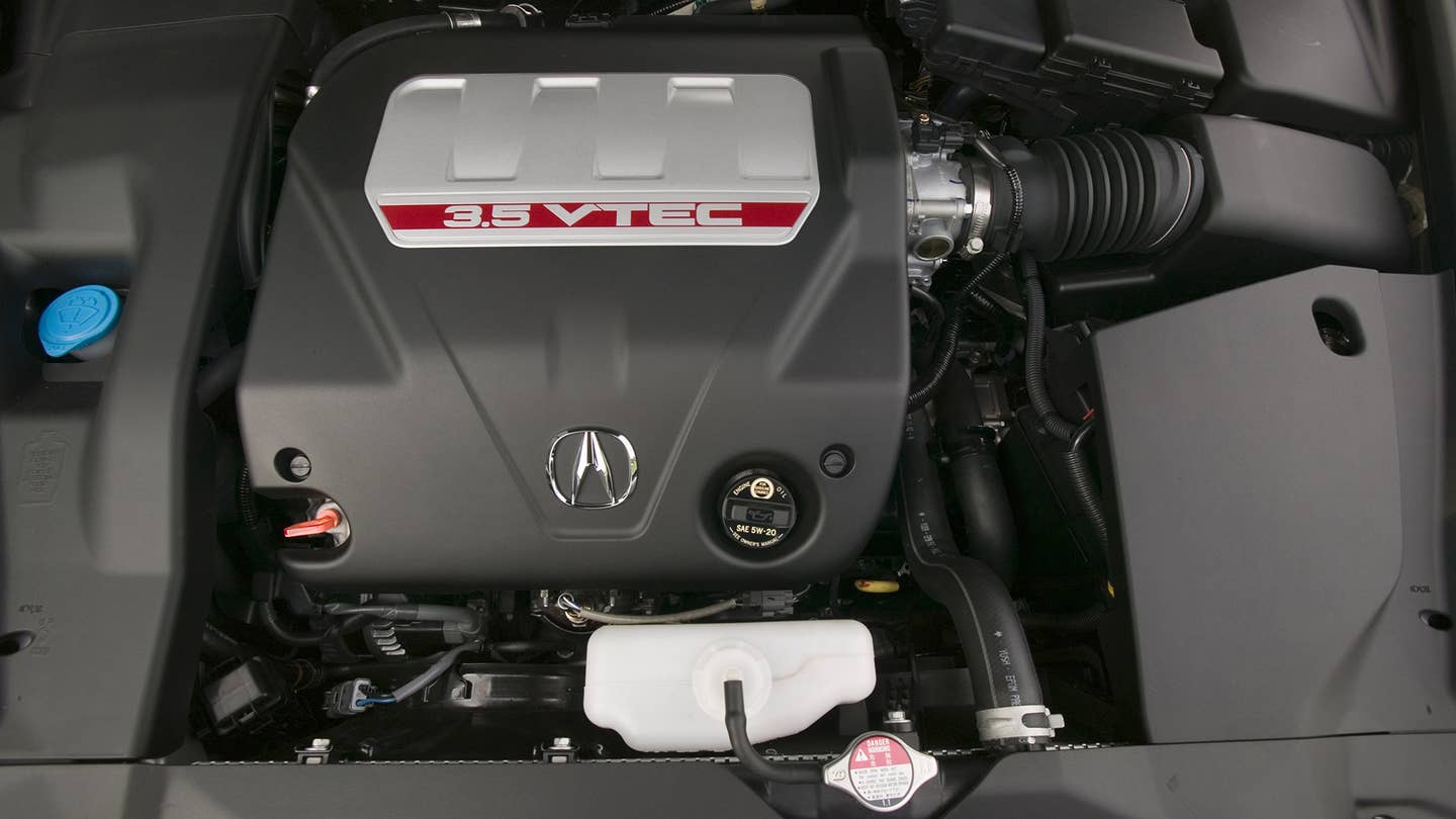 The plastic-covered engine in a 2007-2008 Acura TL Type S. 