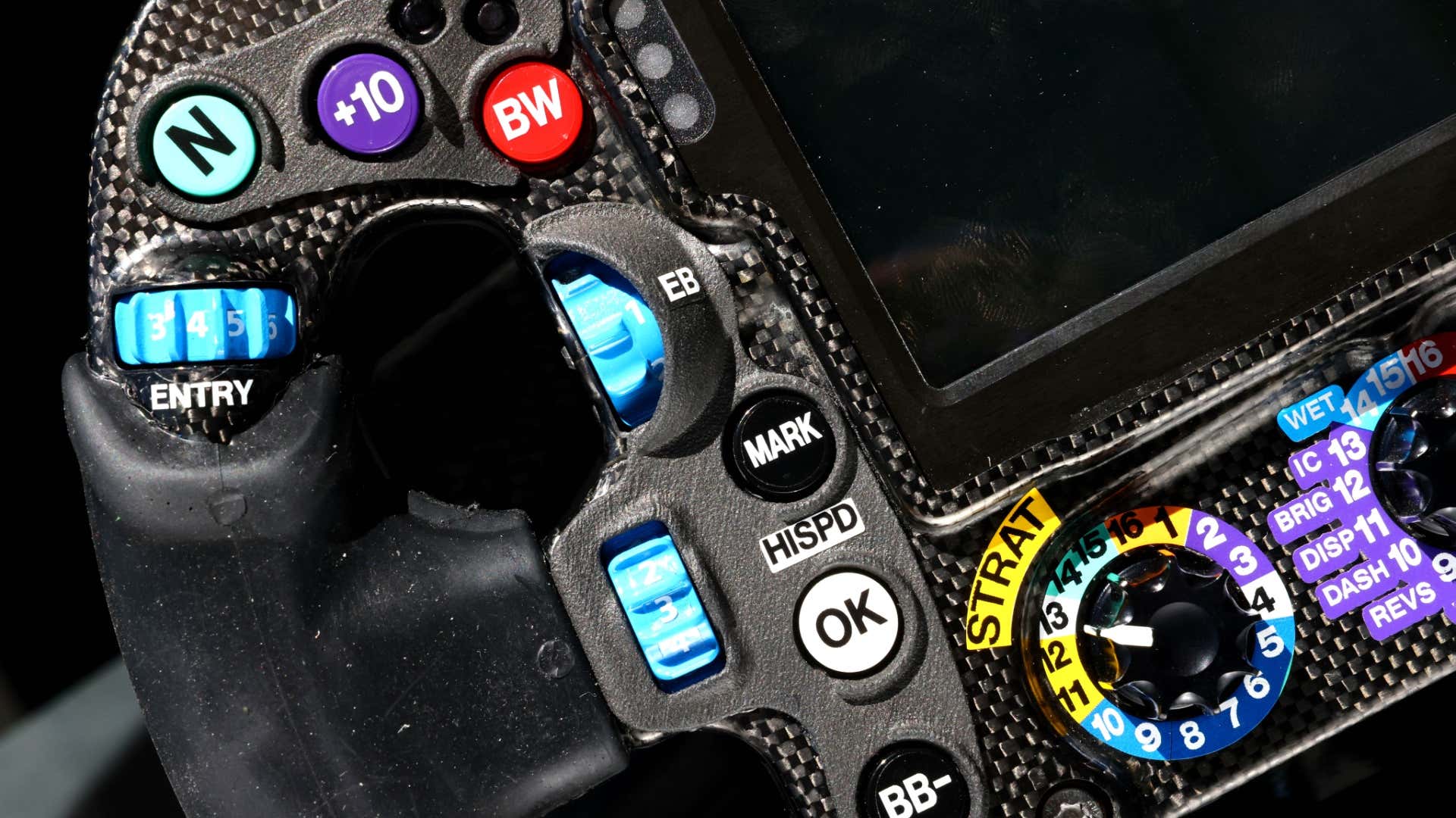 A closeup of Mercedes' steering wheel.