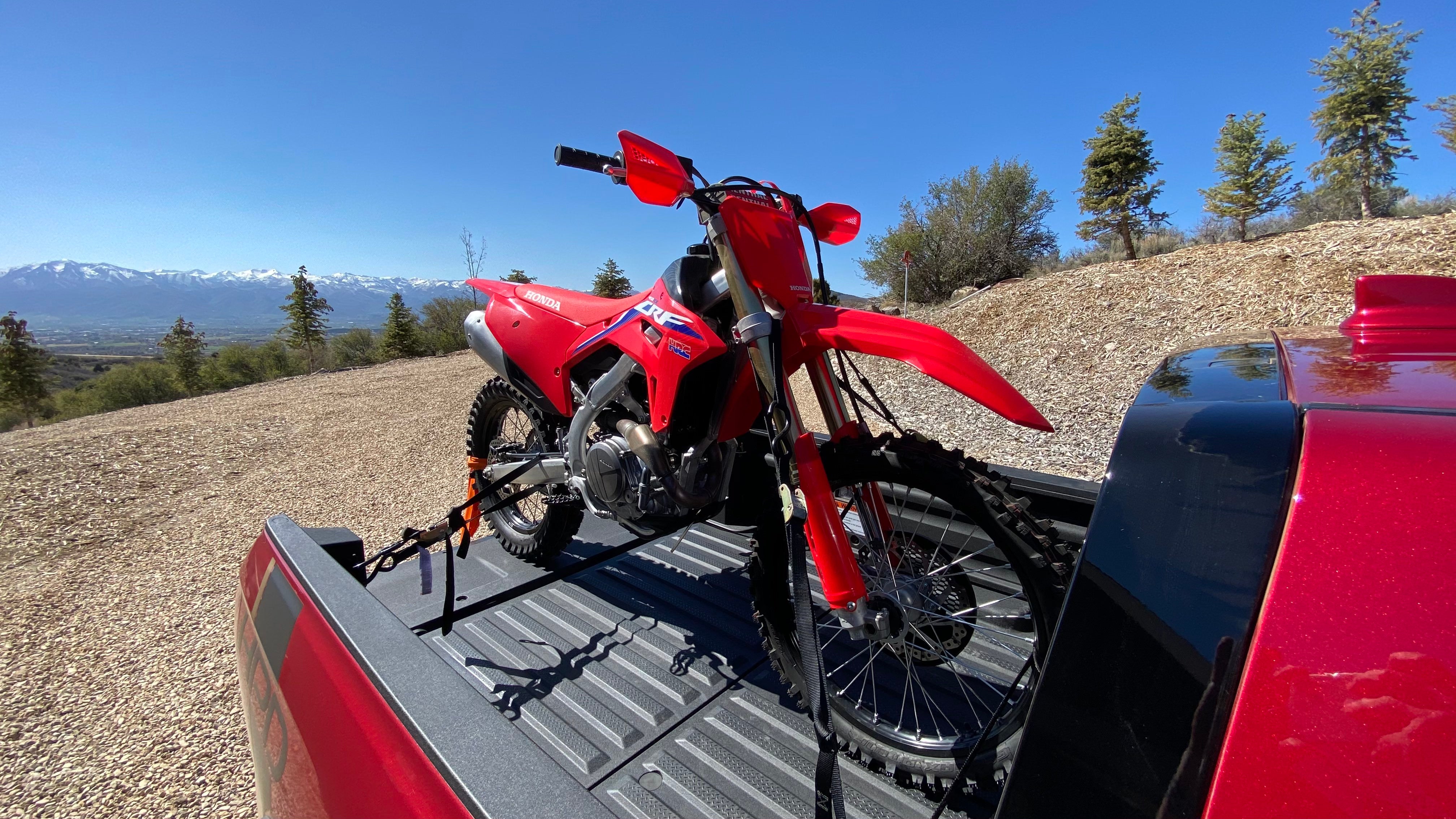 A closeup shot of the CRF450RX in the pickup's bed. 