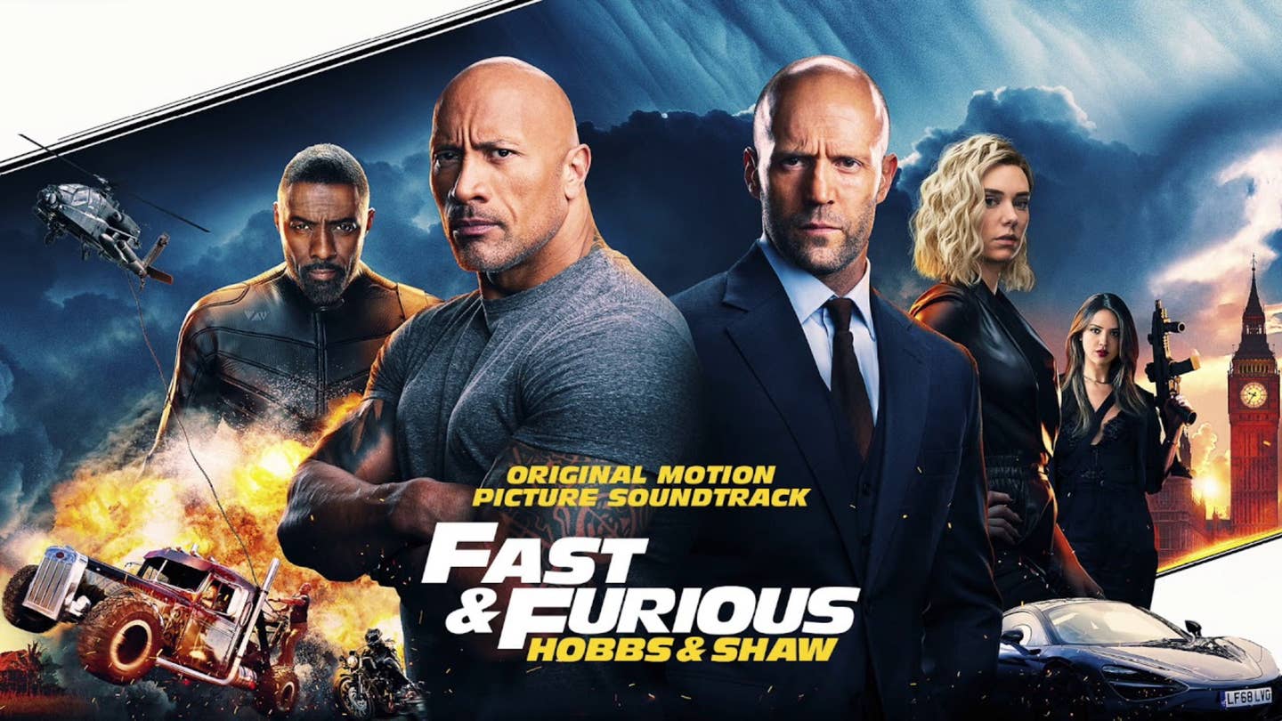 A promo for Fast and Furious Presents Hobbs and Shaw with dark clouds, guns, helicopters, cars, trucks, and explosions.