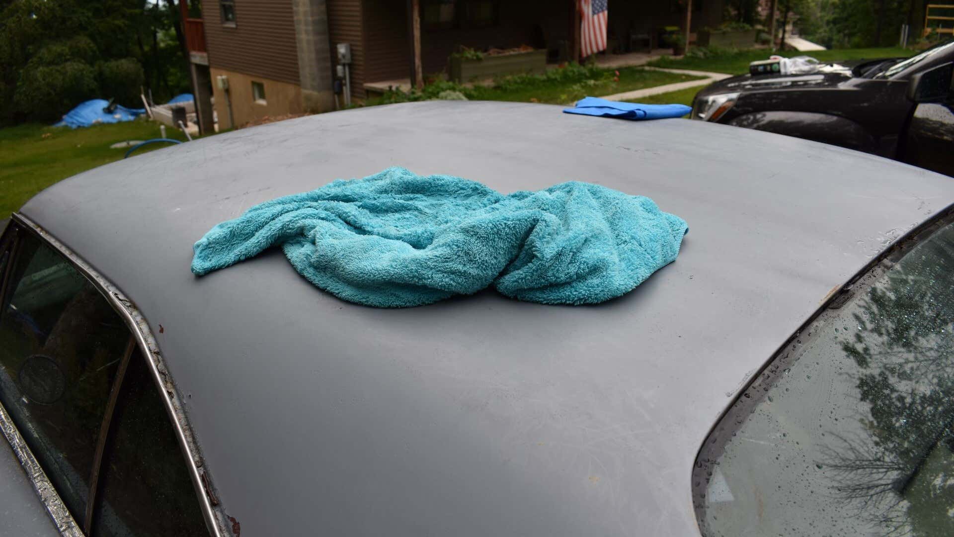A microfiber towel on the roof of a '69 Dodge Charger.