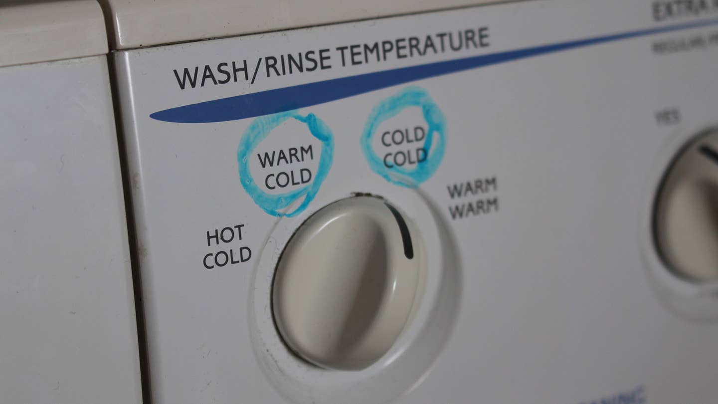 A wash and rinse temperature dial on a washing machine.