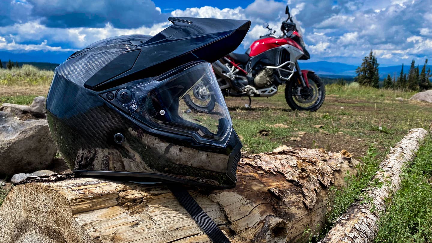 AGV's AX9 helmet and the Ducati by some logs.