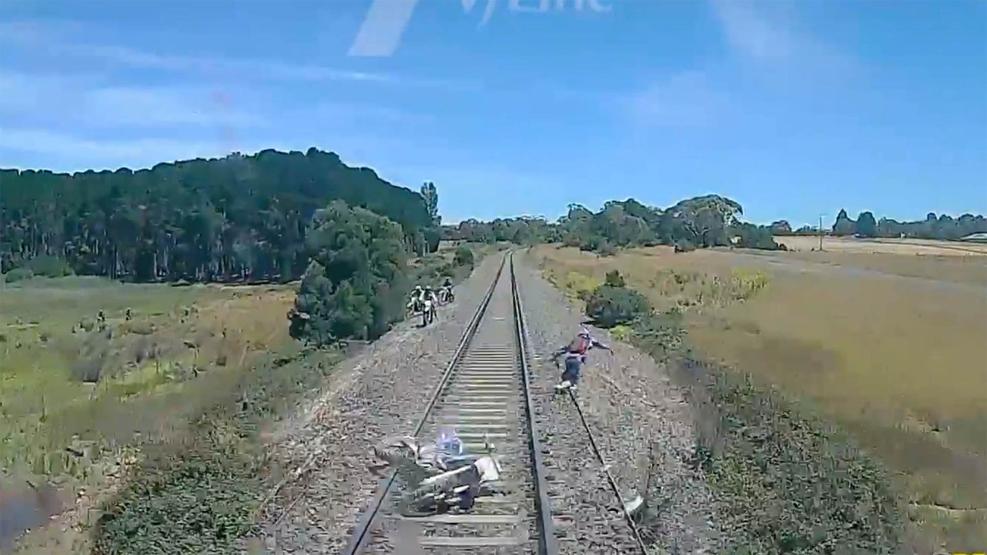 Watch Three Dirt Bike Riders Barely Evade an Oncoming Train