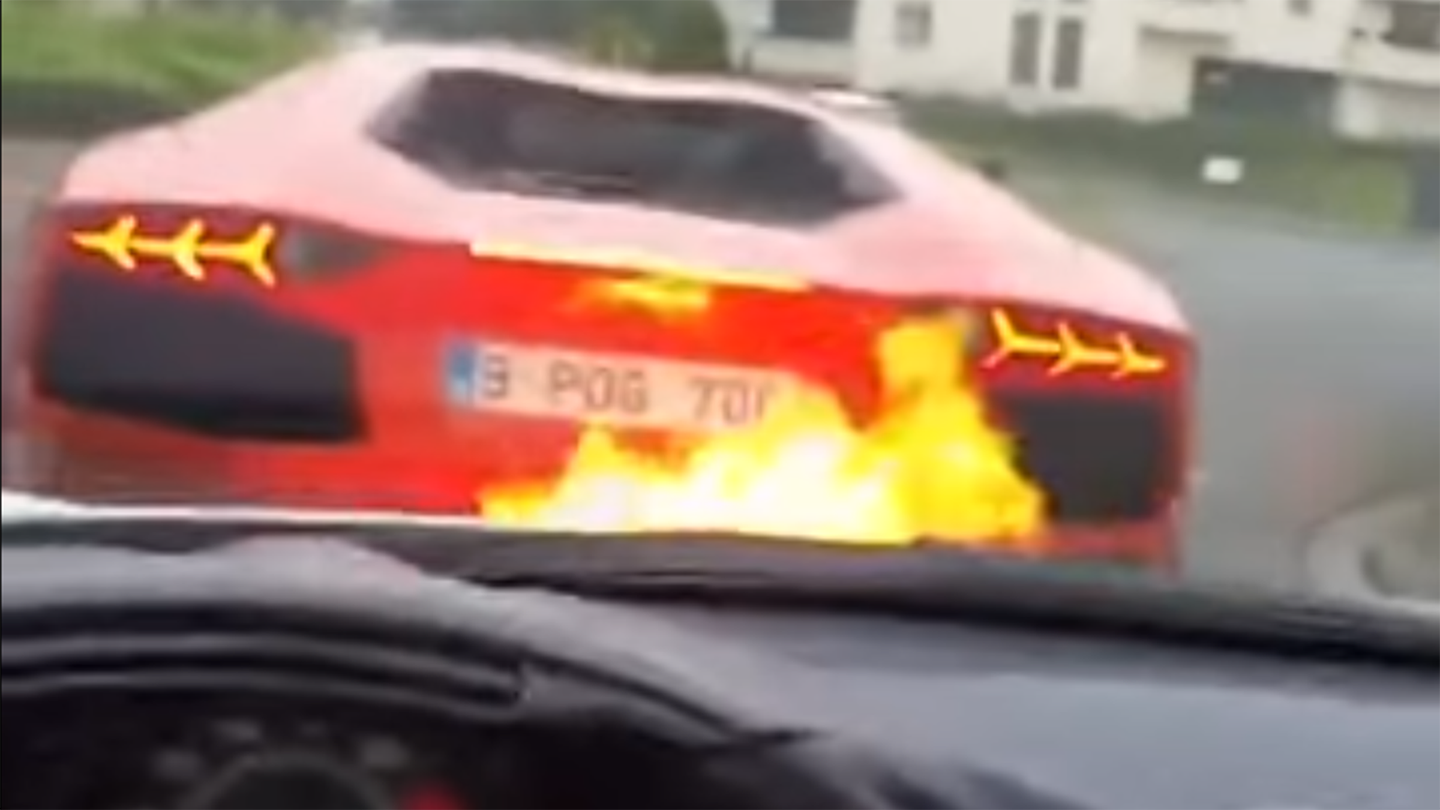 Watch This Lambo Shoot Flames All Over a Ferrari&#8217;s Hood