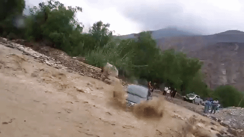 Peru Man Escapes Through Windshield After Flood Waters Crash His Car