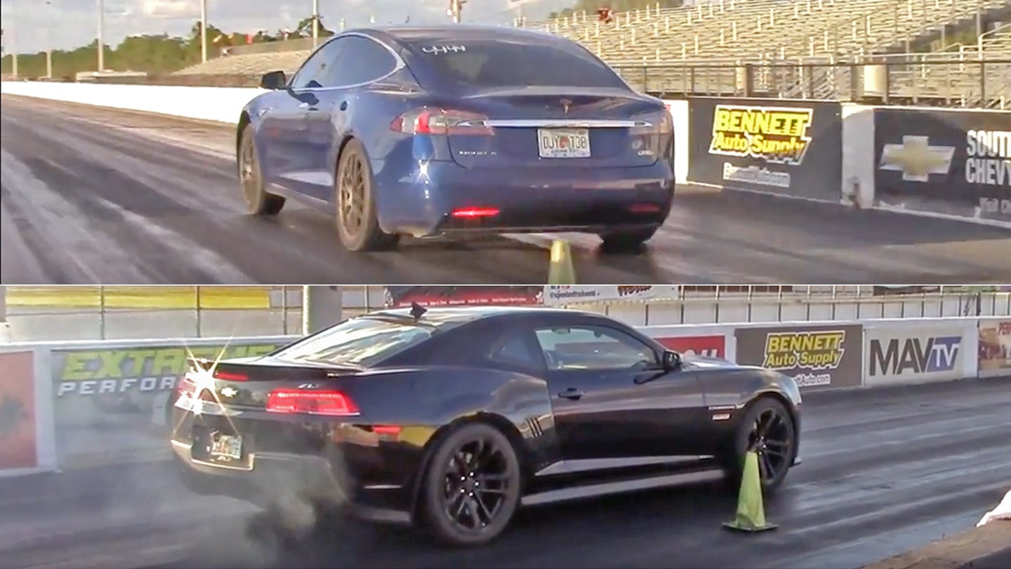 watch a tesla model s p100d whip a modified camaro zl1 with a 10 7 second quarter mile