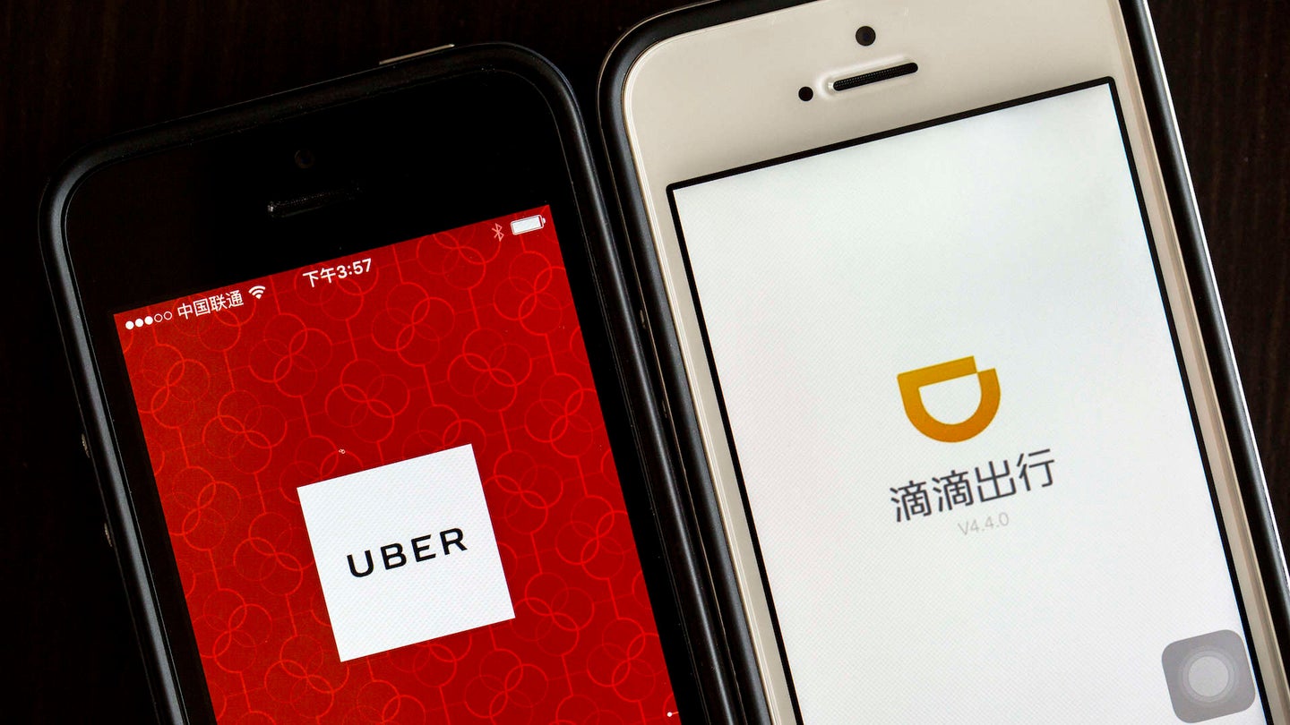 Apps of Uber and Didi Chuxing on smart phone.  Uber is