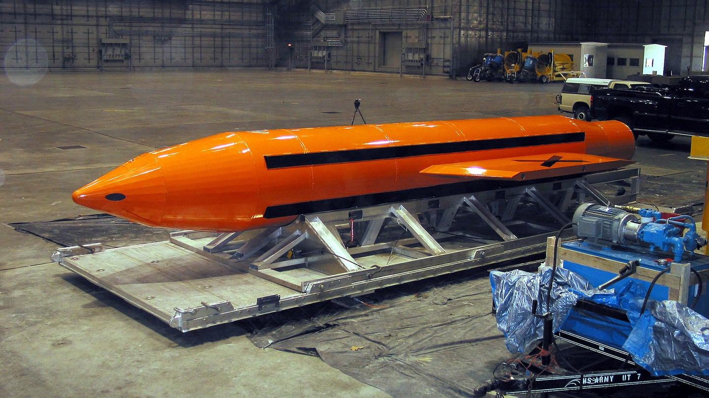 030311-D-9085M-007 A Massive Ordnance Air Blast (MOAB) weapon is prepared for testing at the Eglin Air Force Armament Center on March 11, 2003. The MOAB is a precision-guided munition weighing 21,500 pounds and will be dropped from a C-130 Hercules aircraft for the test. It will be the largest non-nuclear conventional weapon in existence. The MOAB is an Air Force Research Laboratory technology project that began in fiscal year 2002 and is to be completed this year. DoD photo. (Released)