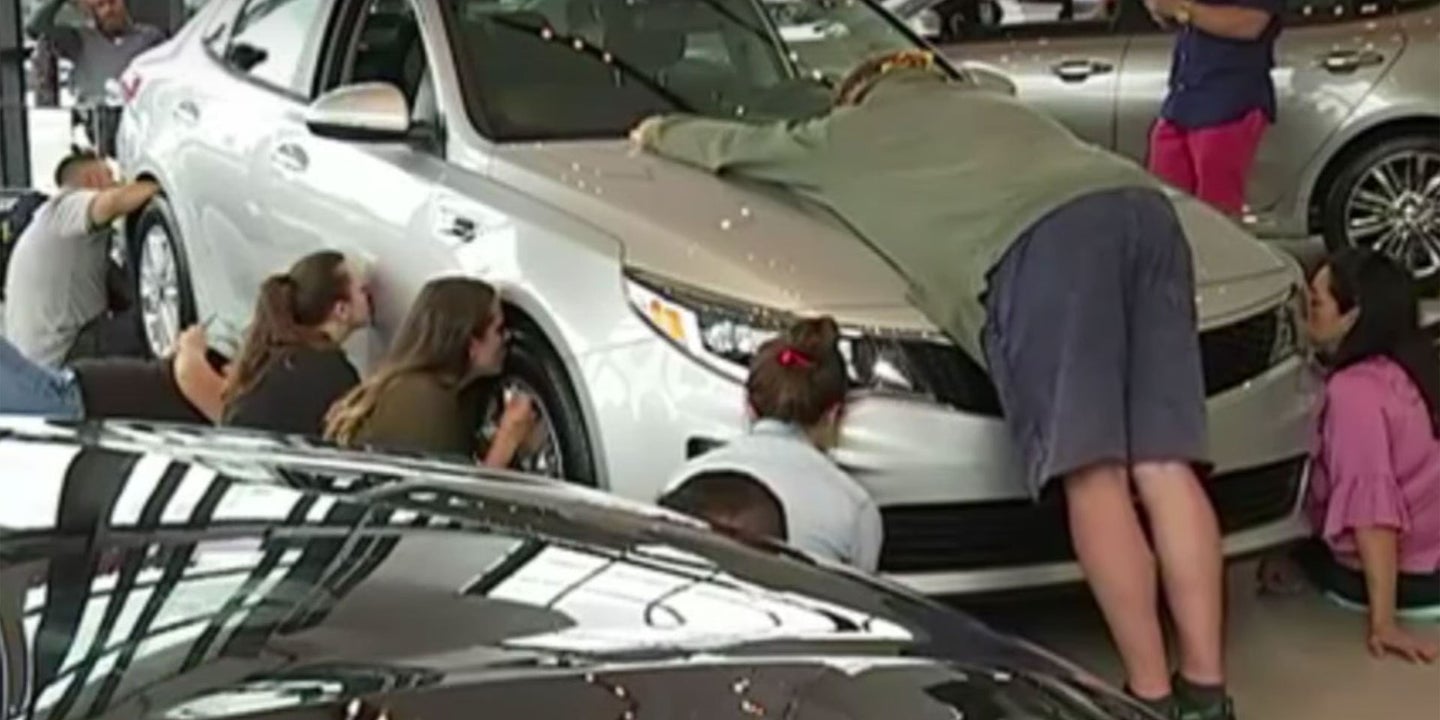 Watch These People Kissing a Kia for Hours in Texas Right Now