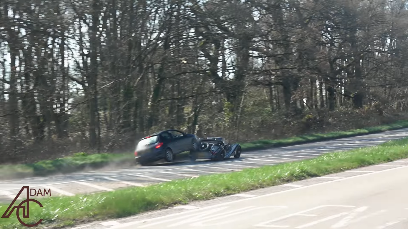 Watch a Morgan Get Its Wood Smashed by a Small French Hatchback