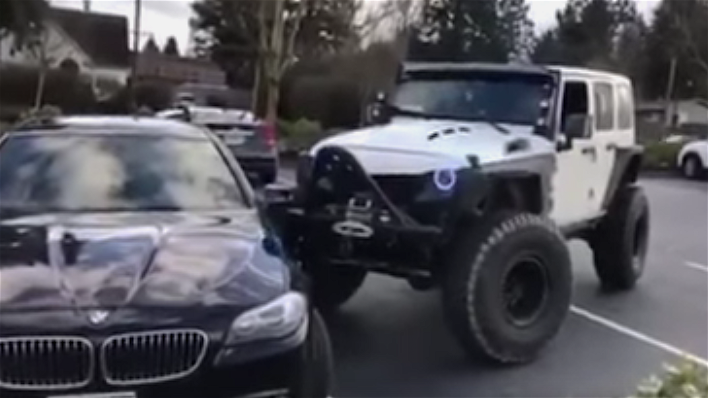 Watch a Jeep Wrangler Push a BMW Into Its Parking Spot