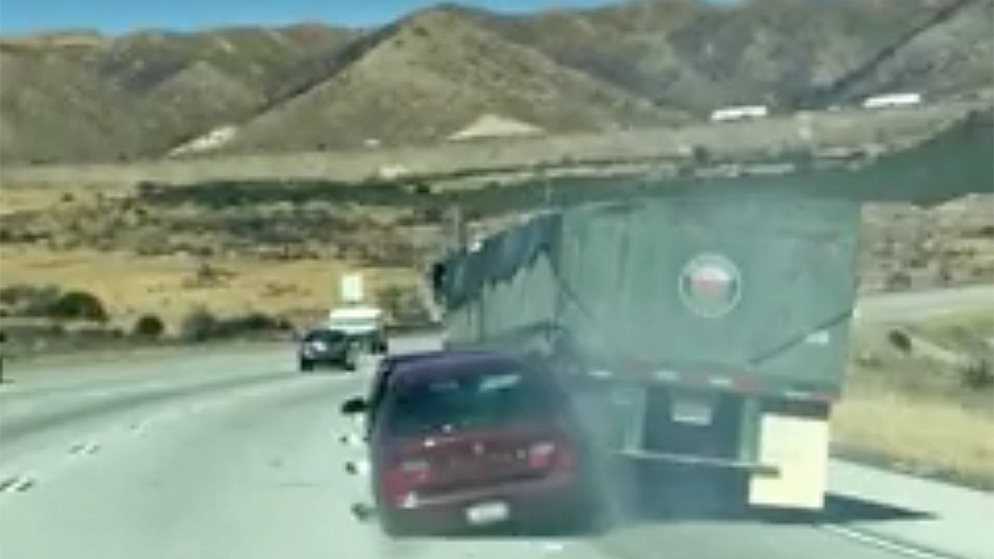 Watch This Oblivious Semi-Truck Driver Drag a Car Down the Highway