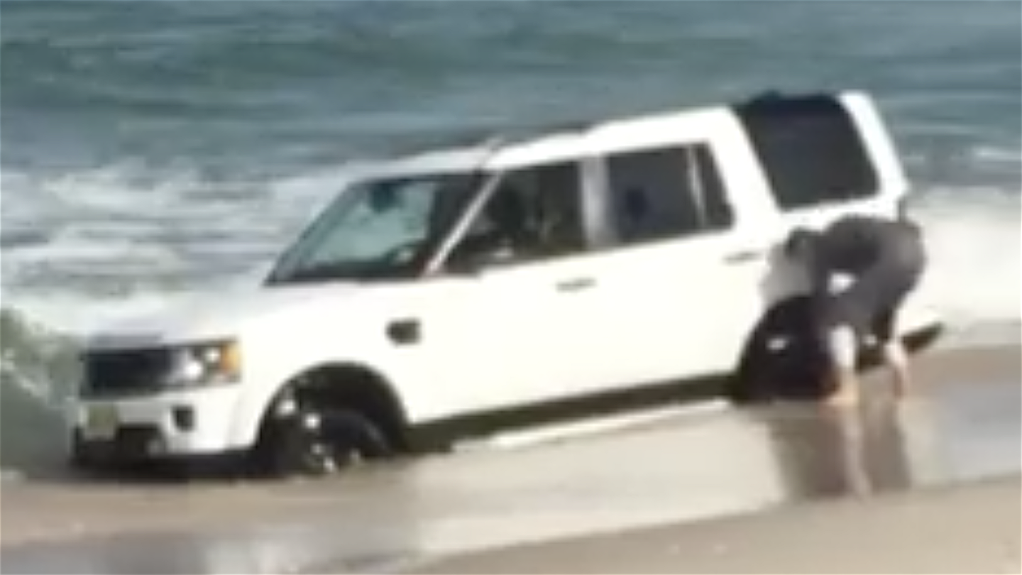 Watch a New Jersey Beach Swallow a Land Rover LR4