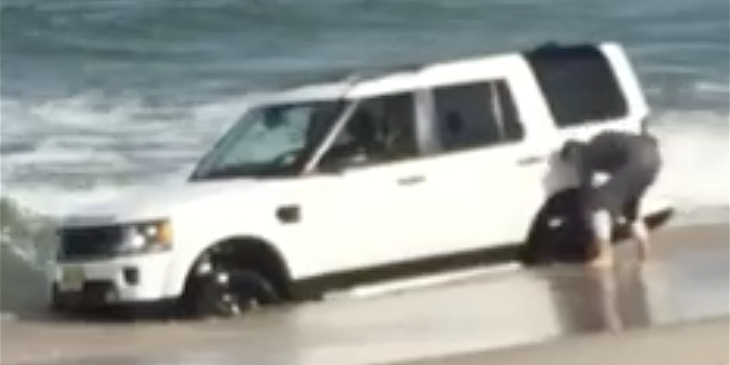 Watch a New Jersey Beach Swallow a Land Rover LR4