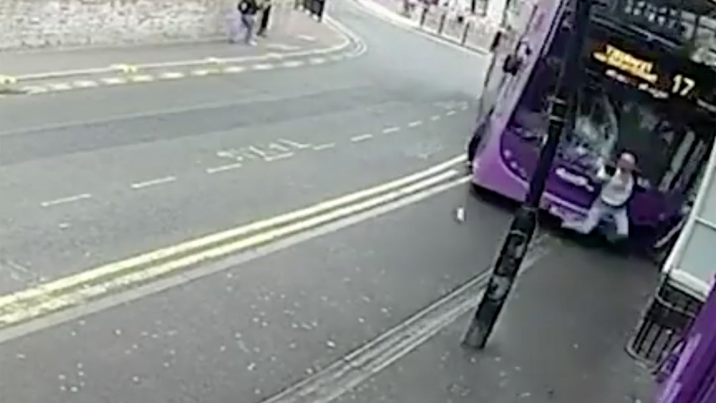 Watch This Pedestrian Get Blasted by a Bus and Walk Away