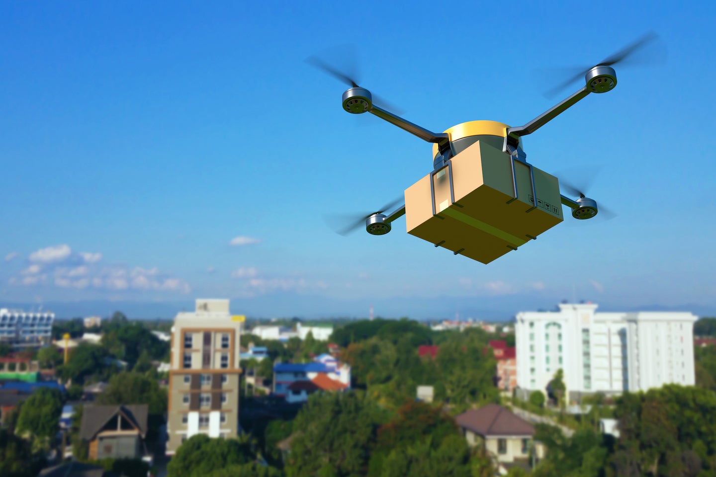 Delivery drone with the cardboard box.