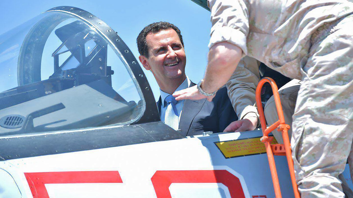 Amid US Threats, Assad Appears At The One Place He’s Safe—Russia’s Syrian Air Base