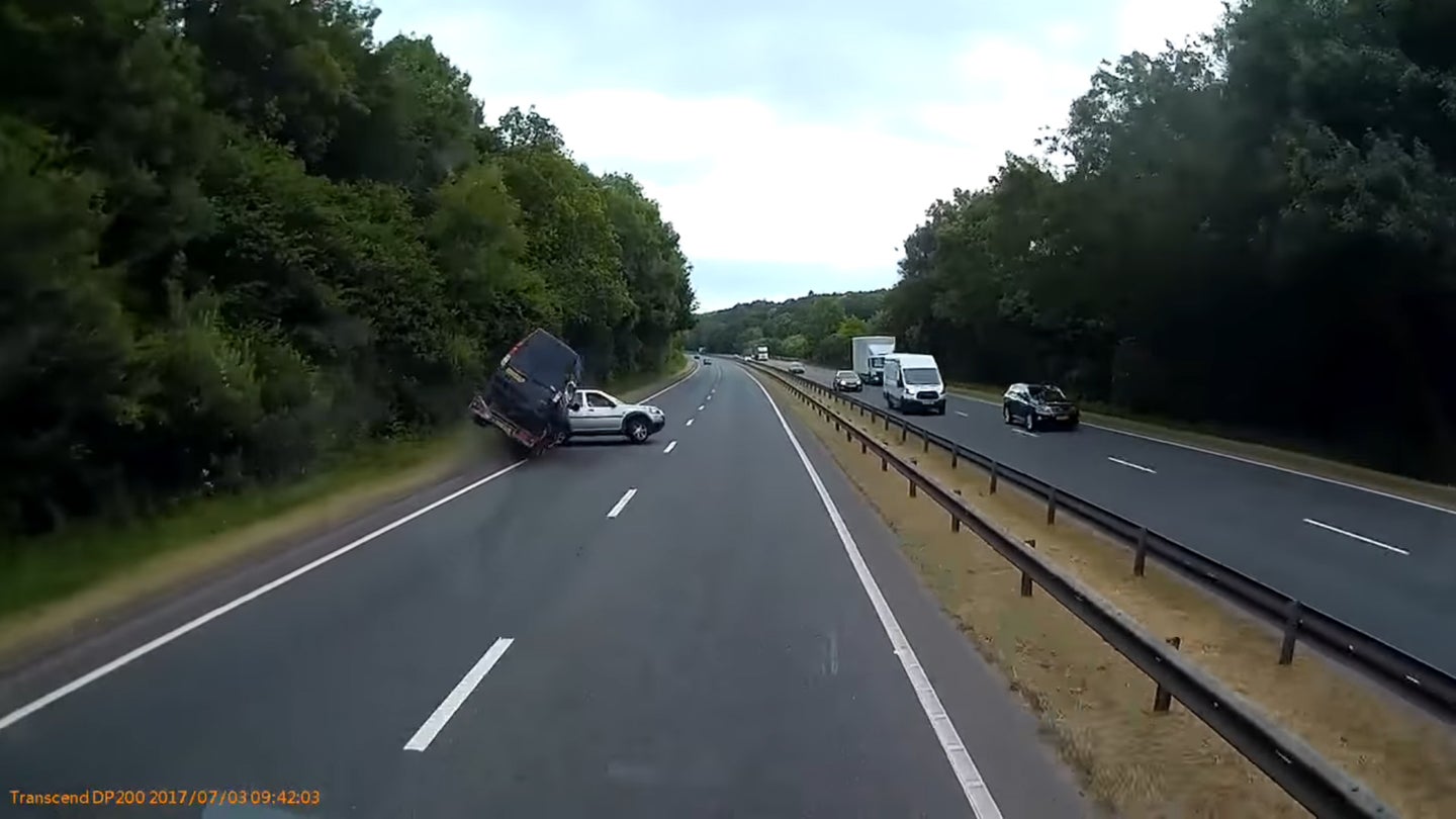 Watch a Driver Wreck While Towing a Van Poorly