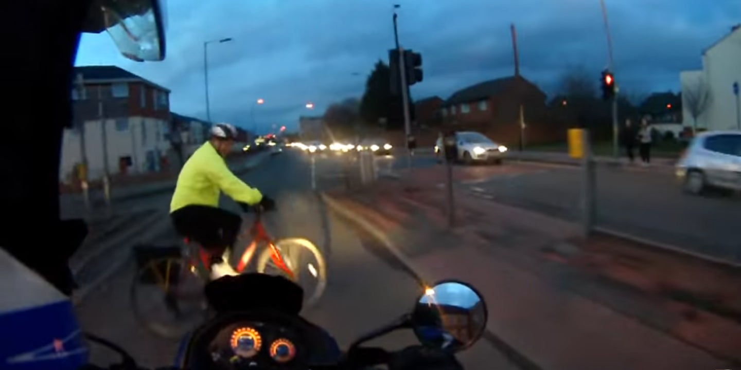 Watch This Biker and Cyclist Collide in an Intersection