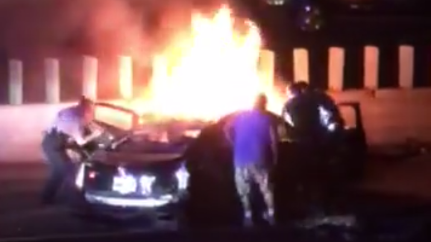 Intense Video Shows Police, Bystanders Pulling Victims from Burning Cadillac