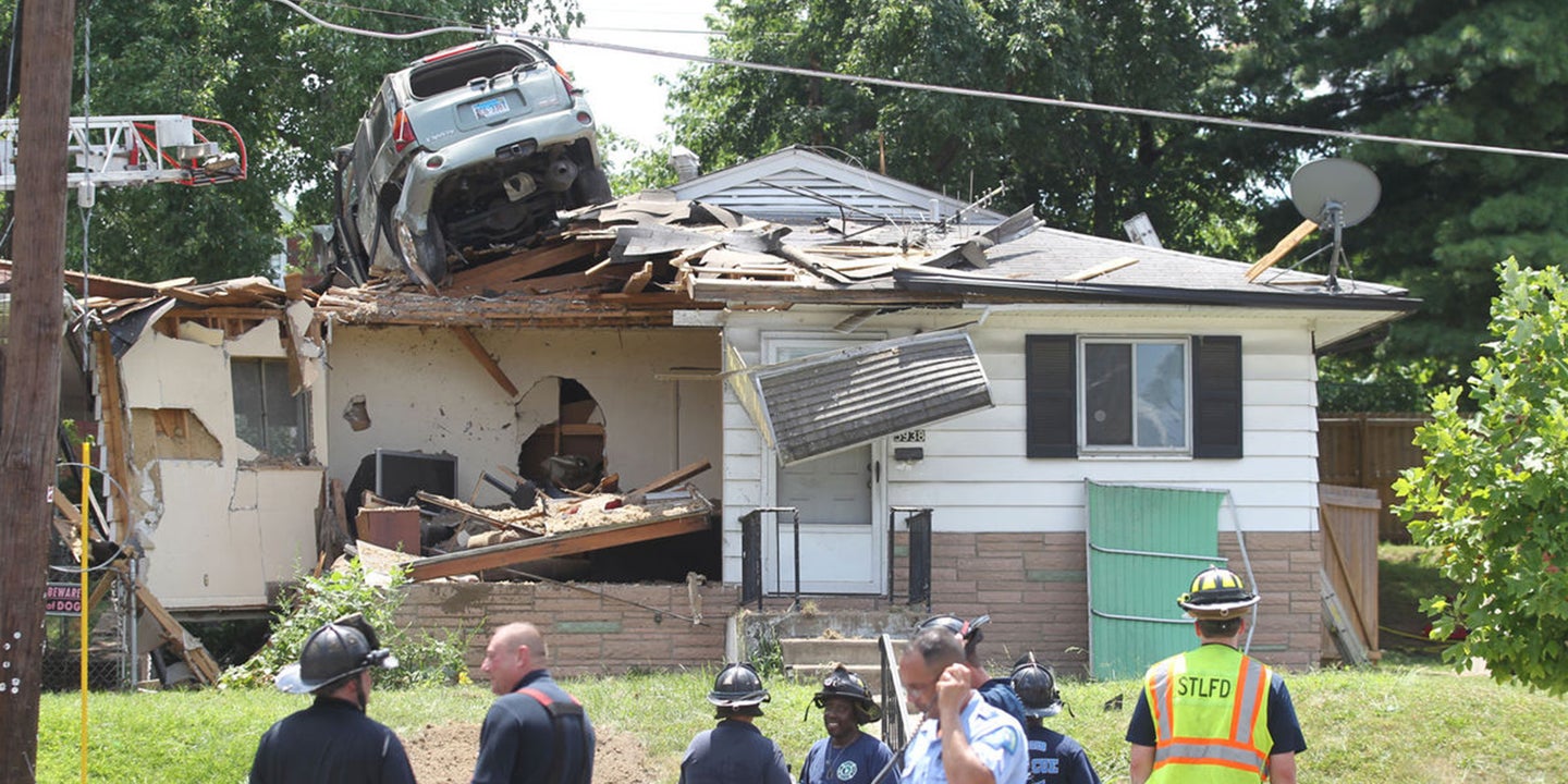 SUV Crashes on Roof of House in St. Louis