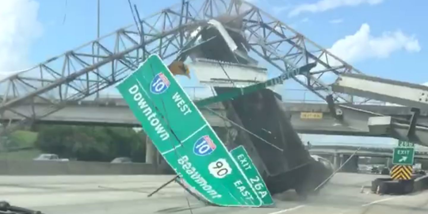 Watch This Dump Truck Flip After Smashing Highway Sign With Raised Bed