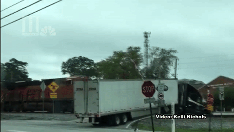 Watch a Freight Train Slam Into a Tractor-Trailer Truck Filled With Candy  in Georgia