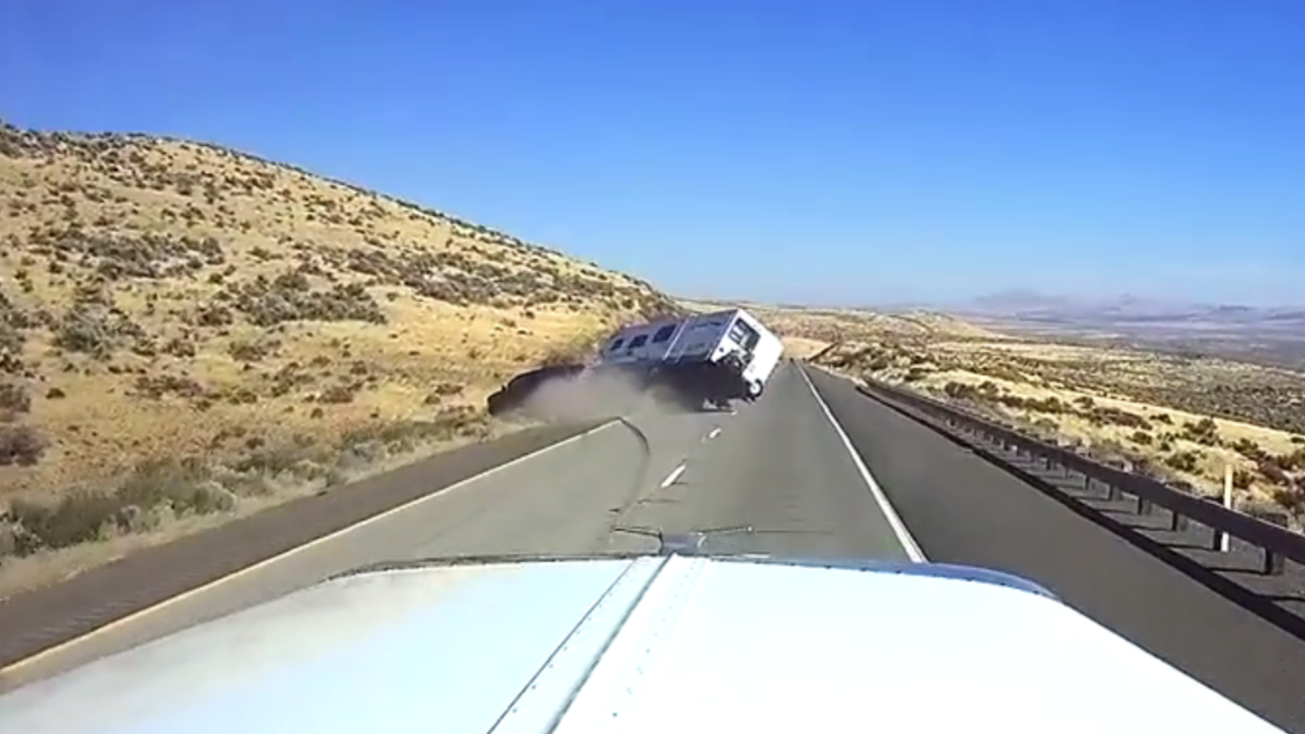 Watch This Speeding SUV Lose Control and Flip While Towing a Camper
