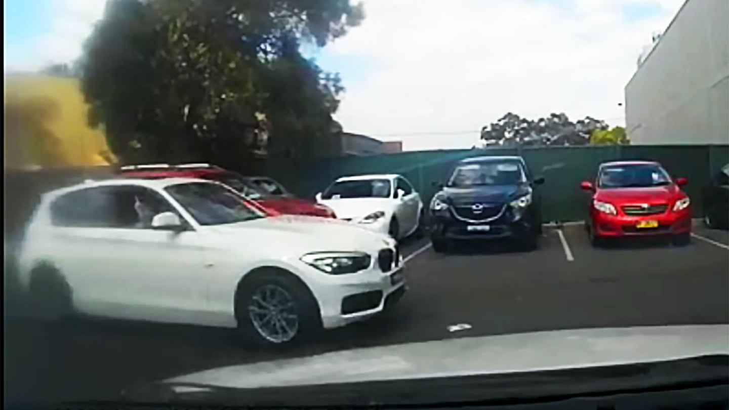 Watch This BMW Driver Throw Money in Anger At Another Car