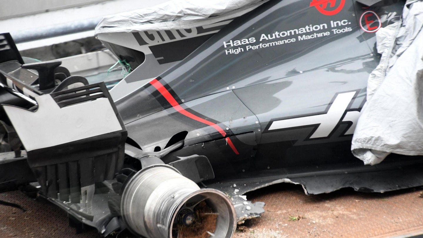 Roman Grosjean Hits Drain Cover in Formula One Practice at Malaysia Grand Prix