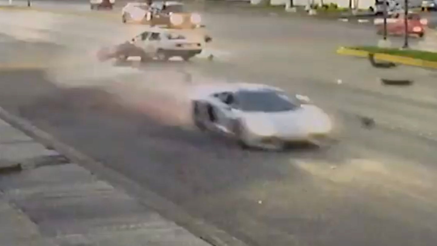 Watch This Lamborghini Aventador Demolish a Taxi Making an Illegal U-Turn
