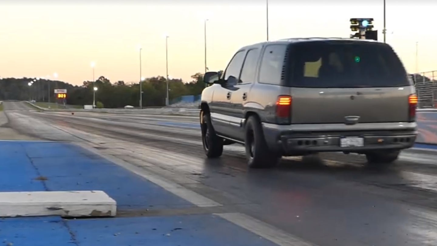 Watch This Chevrolet Tahoe Destroy a Camaro With a Nine Second Quarter-Mile Run