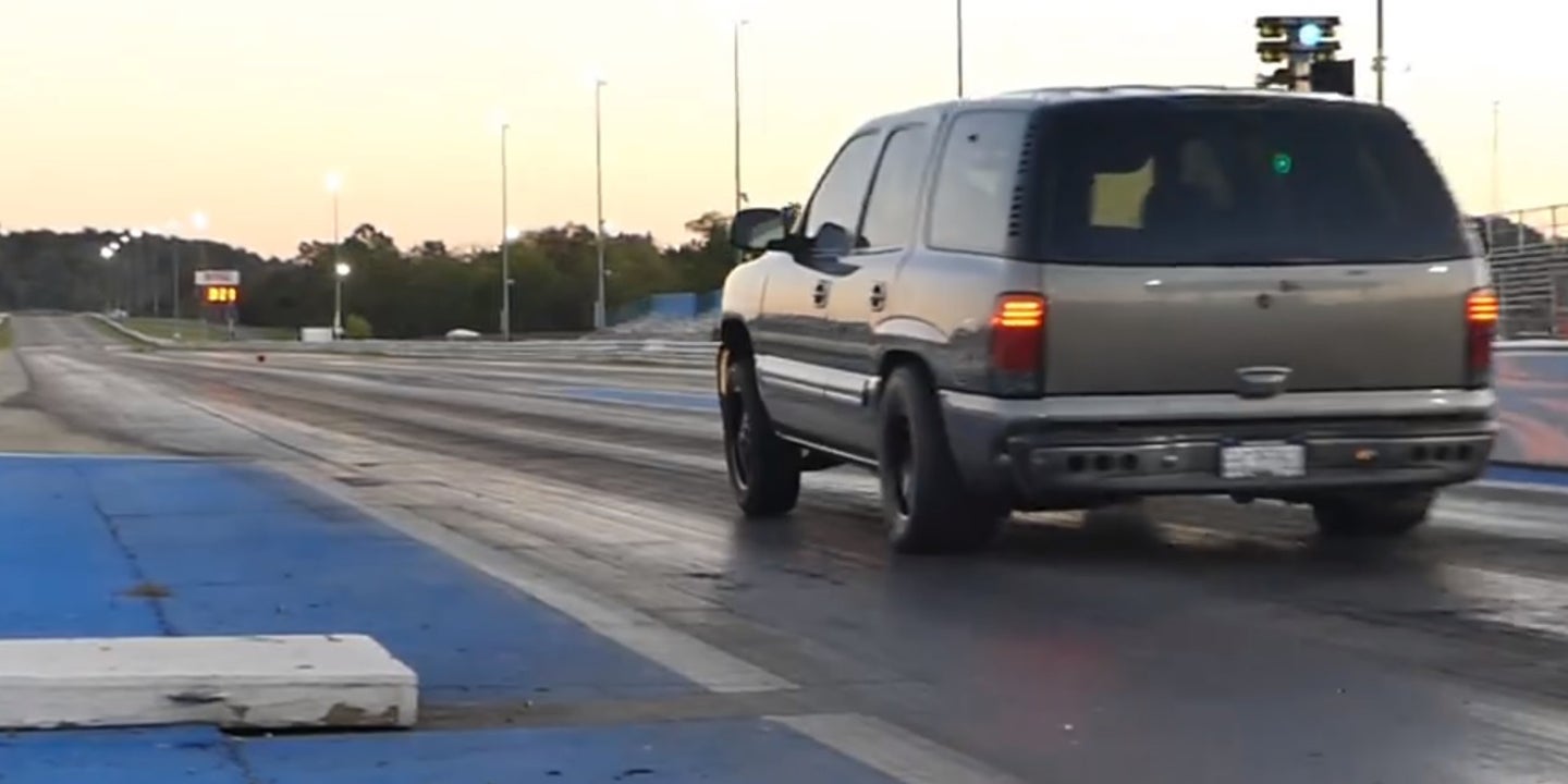 Watch This Chevrolet Tahoe Destroy a Camaro With a Nine Second Quarter-Mile Run