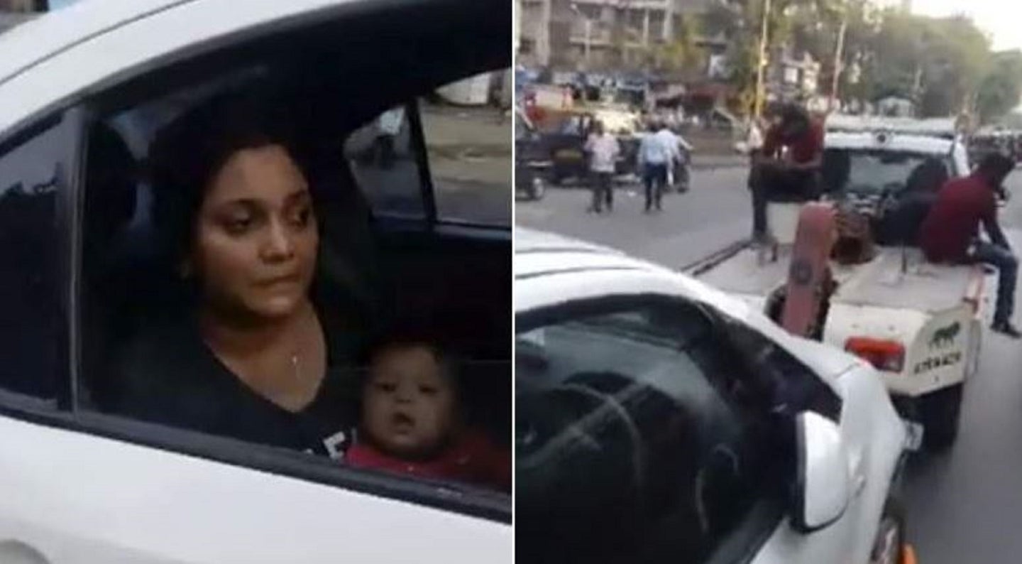 Woman Towed While Breastfeeding Baby in Car