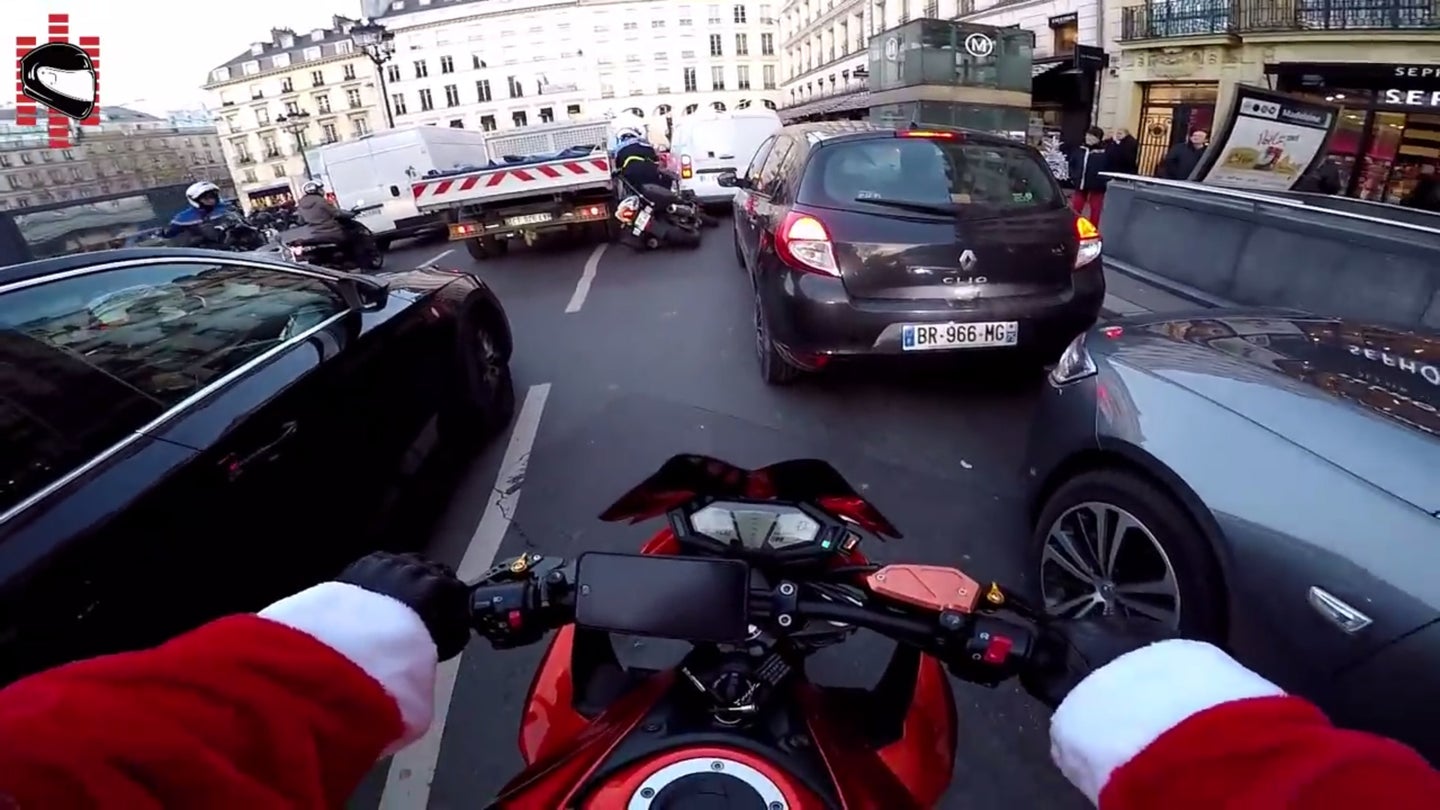 Watch This Motorcyclist Dressed as Santa Chase Down a Hit and Run Driver