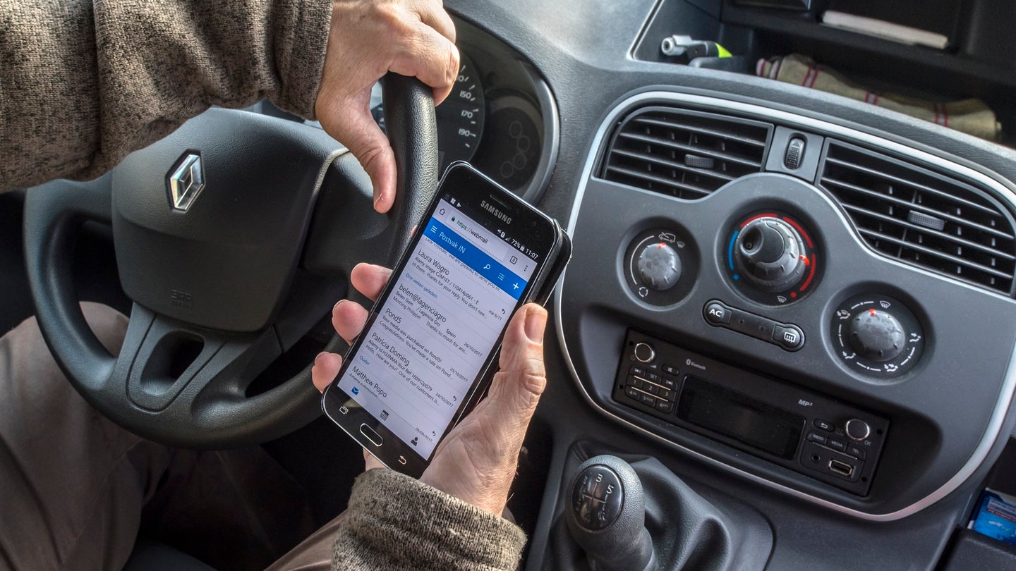 Men More Likely to Drive Distracted Than Women, Survey Says