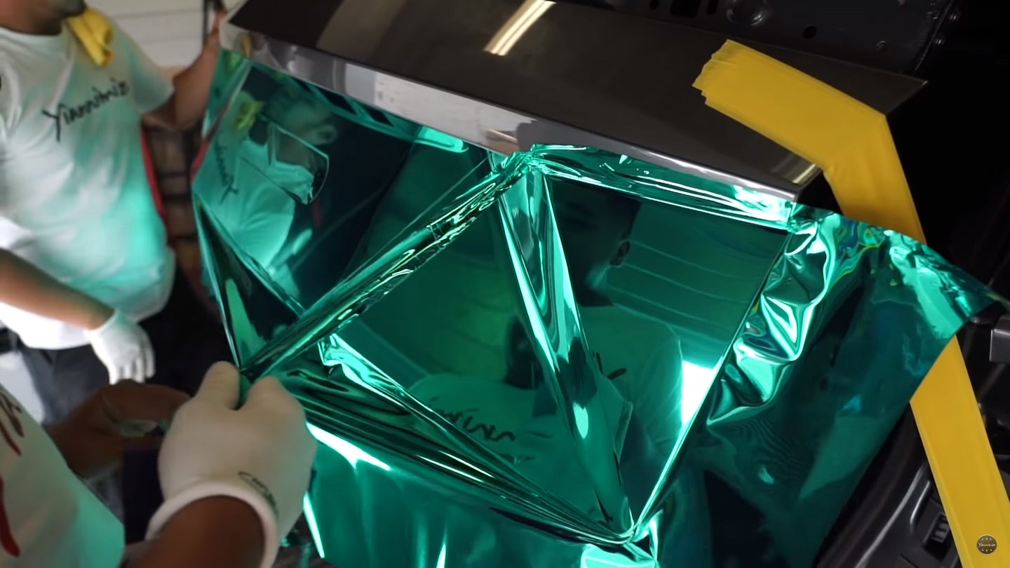 Watch the Tedious Process of a Lamborghini Urus Getting Wrapped in Turquoise Vinyl