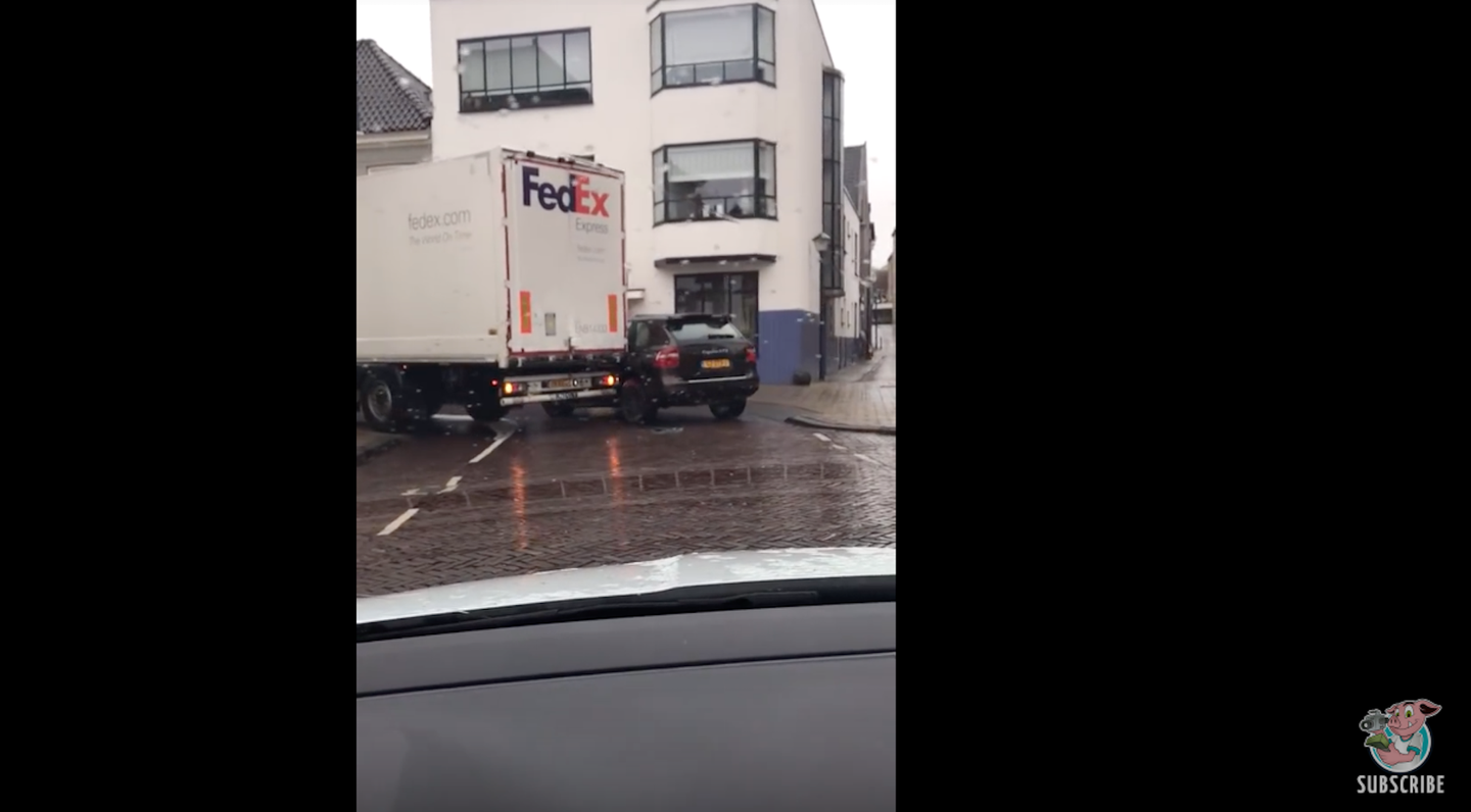 Watch a Delivery Truck Crash Into and Drag a Poorly Parked Porsche