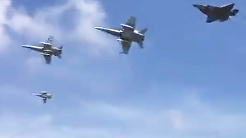 RAAF Hornet Escorts Pull Off Jaw-Dropping Overhead Break To Welcome Home First Aussie F-35As