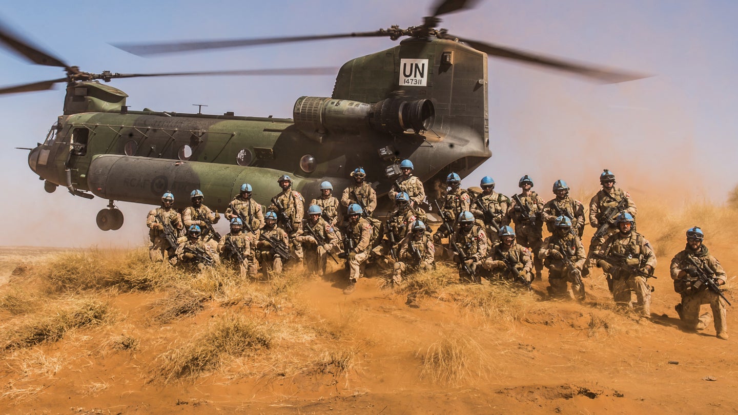 Canadian Troops Pose With Chinook As It Sticks A Pinnacle Landing While On Deployment In Mali