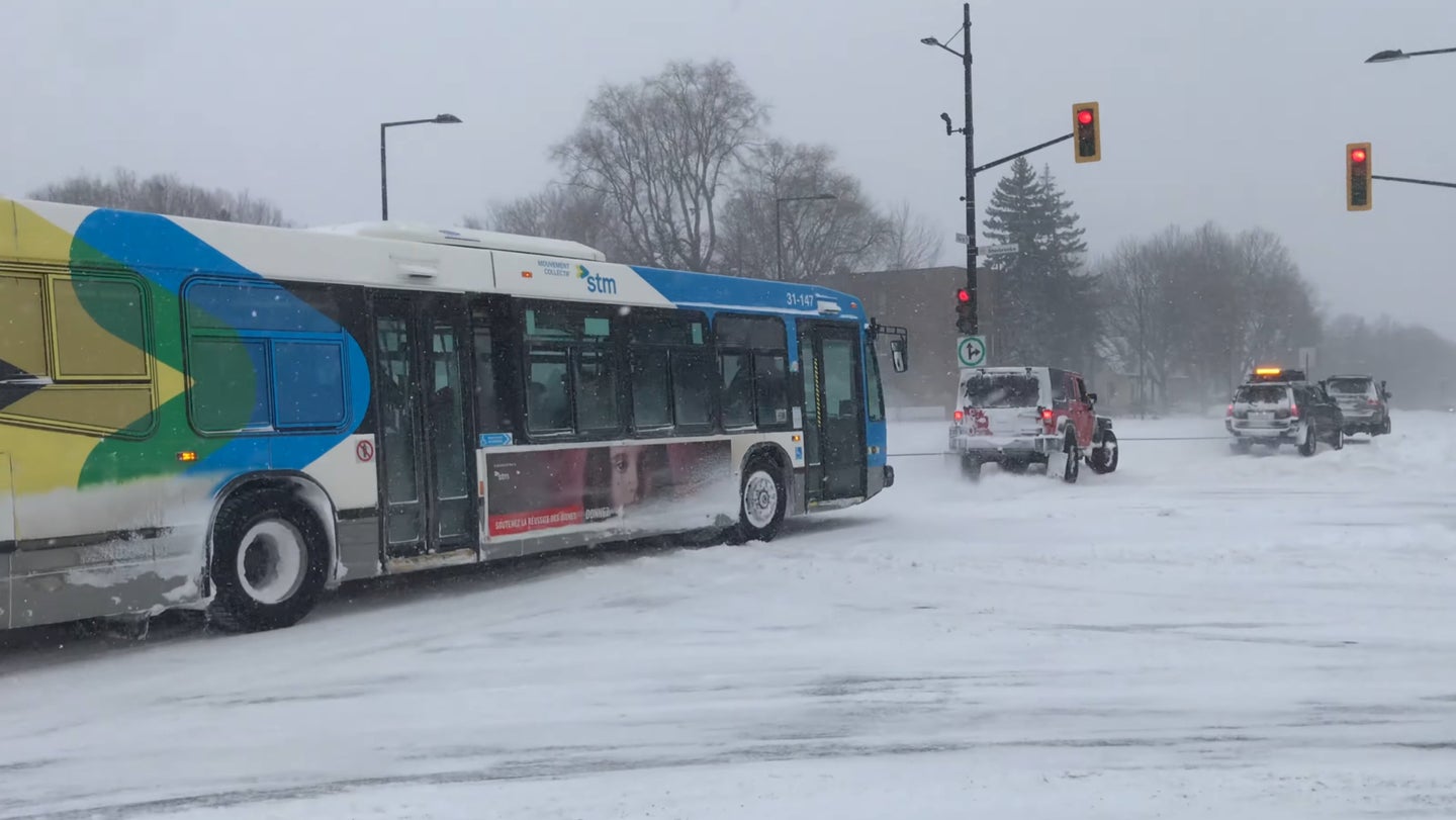 Watch a Jeep Wrangler and 2 Toyota Trucks Rescue a City Bus Stuck in Snow