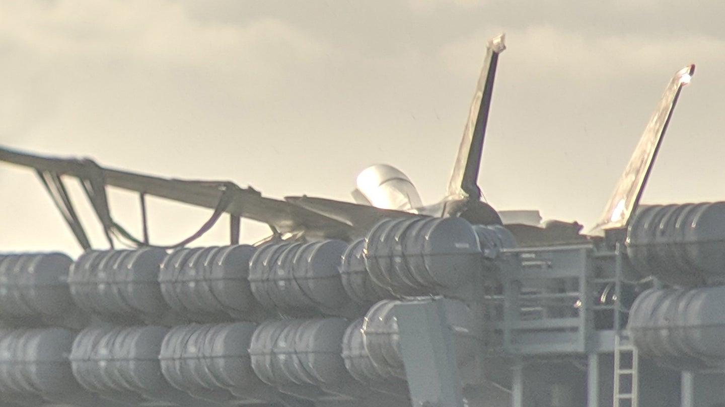 Photos Show F-14 Used In Top Gun 2 Production Snared In Carrier&#8217;s Crash Barricade