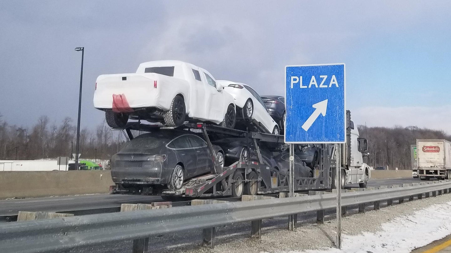 Lone Wrapped Pickup on Tesla Car Carrier Full of Model 3s Sparks Speculation