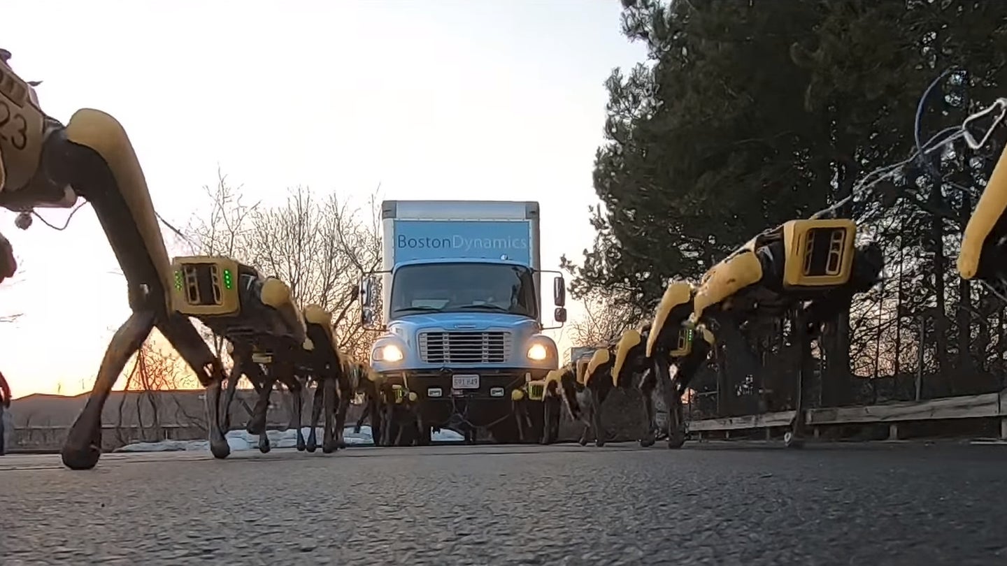 Watch This Pack of Headless Robotic Dogs Pull a Loaded Semi Truck Across a Parking Lot