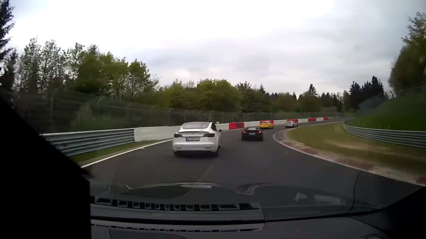 Watch a Tesla Model 3 Put Up Solid Fight Against BMW M2 on the Nurburgring